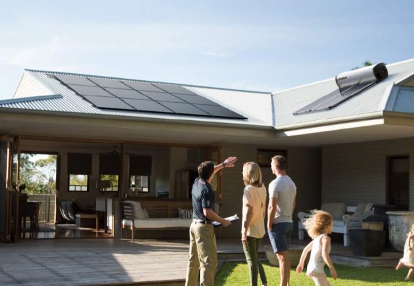 Solahart Installer and home owners discussing Solarpanels